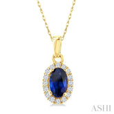 5x3 MM Oval Shape Sapphire and 1/20 Ctw Round Cut Diamond Halo Precious Pendant with Chain in 10K Yellow Gold
