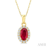 5x3 MM Oval Shape Ruby and 1/20 Ctw Round Cut Diamond Halo Precious Pendant with Chain in 10K Yellow Gold