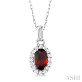 5x3 MM Oval Shape Garnet and 1/20 Ctw Round Cut Diamond Halo Semi-Precious Pendant with Chain in 14K White Gold