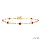 4X3 MM Pear Cut Ruby and 1/20 Ctw Round Cut Diamond Precious Fashion Bracelet in 10K Yellow Gold