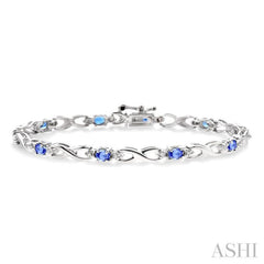4x3mm Oval Cut Tanzanite and 1/10 Ctw Round Cut Diamond Bracelet in 10K White Gold