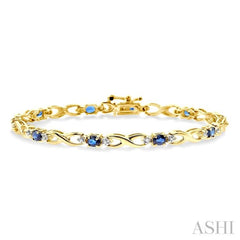 4x3 MM Oval Cut Sapphire and 1/10 Ctw Single Cut Diamond Bracelet in 10K Yellow Gold