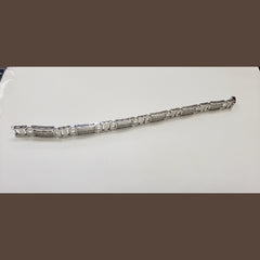 14 karat white gold mens bracelet with diamonds set in the center of each link .