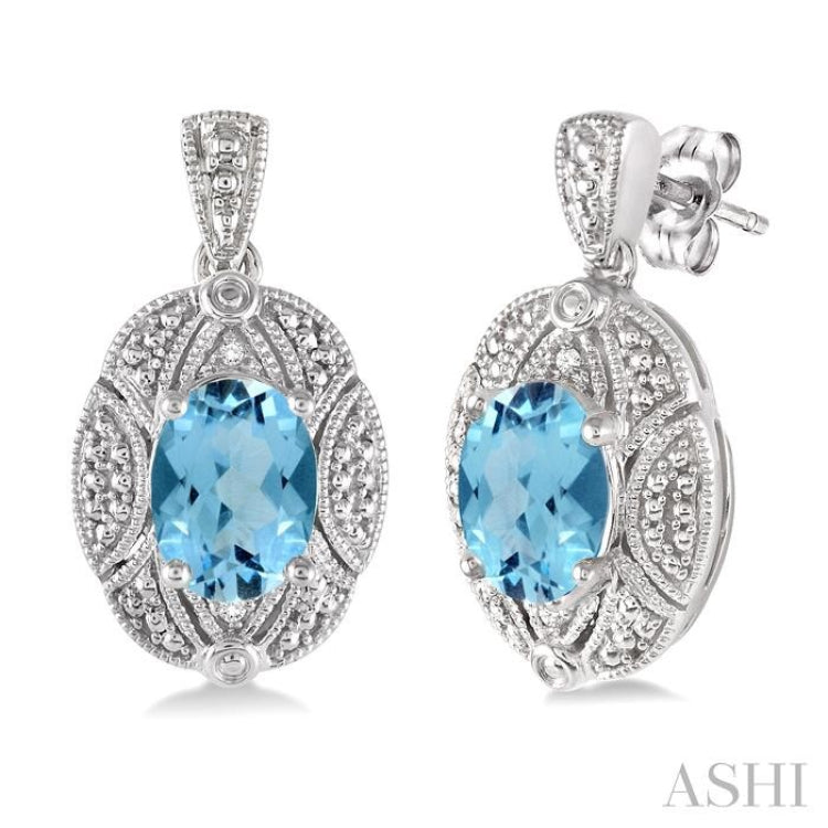 8x6 MM Oval Cut Blue Topaz and 1/50 Ctw Single Cut Diamond Earrings in Sterling Silver