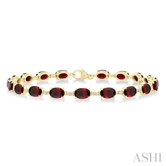 6X4 MM Oval Cut Garnet and 1/6 Ctw Round Cut Diamond Semi-Precious Tennis Bracelet in 10K Yellow Gold
