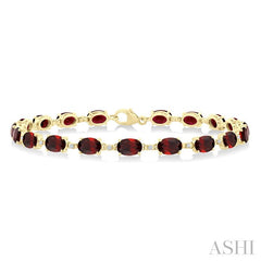 6X4 MM Oval Cut Garnet and 1/6 Ctw Round Cut Diamond Semi-Precious Tennis Bracelet in 10K Yellow Gold