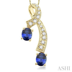 5x4MM Oval Cut Sapphire and 1/6 Ctw Round Cut Diamond Precious Pendant in 14K Yellow Gold with Chain